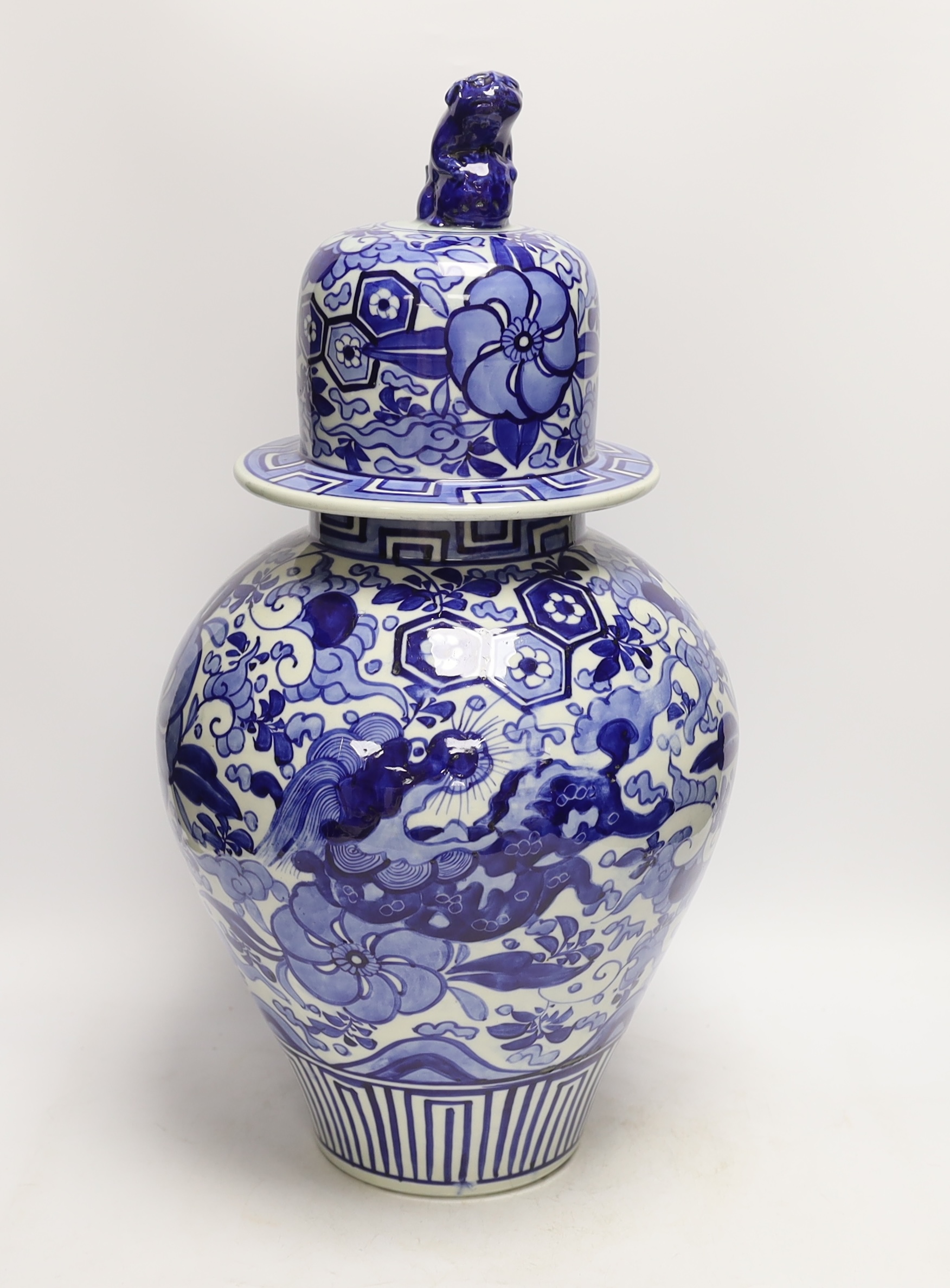 A large Japanese Arita blue and white jar and cover, 54cm